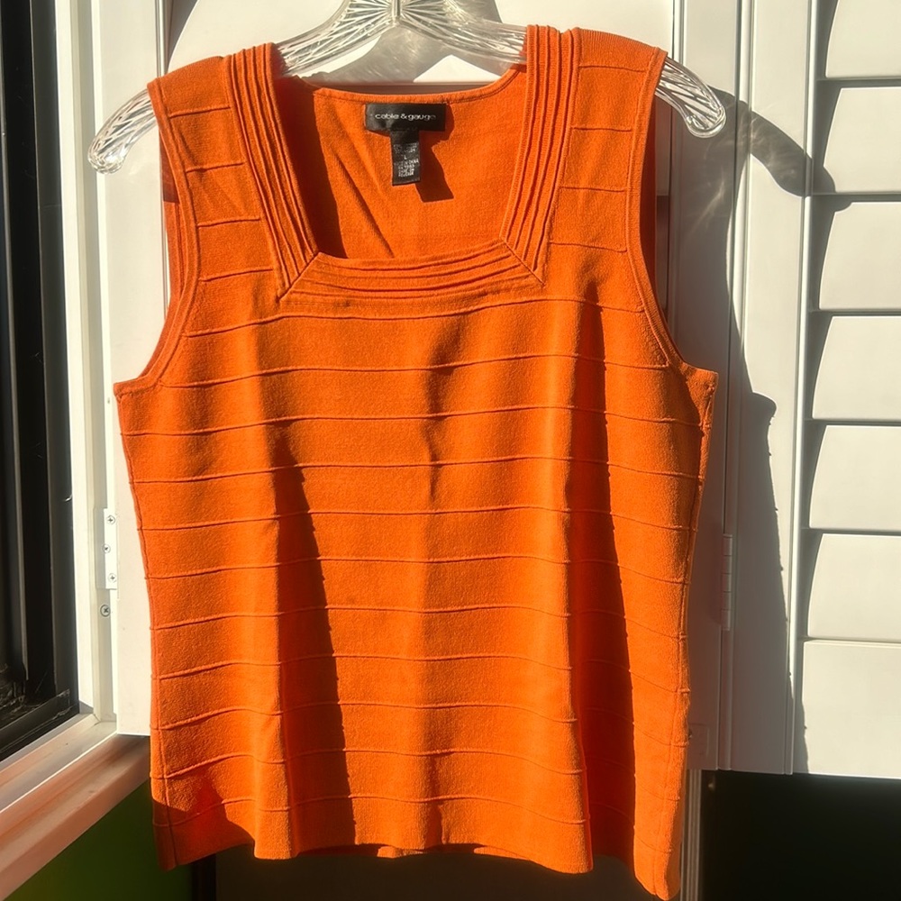 Cable & Gauge sleeveless orange sweater.